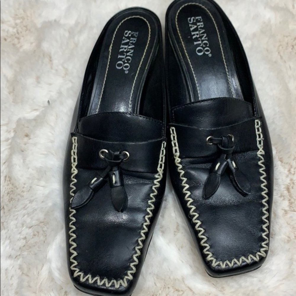 Franco Sarto black and white square toe slides.
